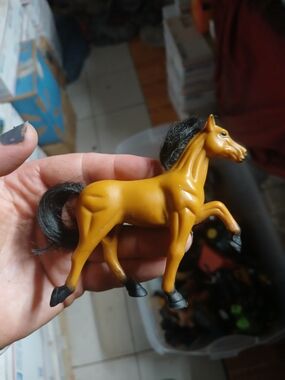 vintage plastic figurine, resembling lines like 1990s Kid Kore Apricot Blak Mane